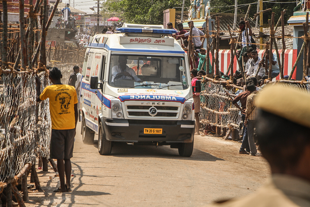 An ambulance rushes from the ground at Alganallur, carrying an injured player. Anticipating possible casualties, ambulances and a number of medical teams are stationed at the arenas.