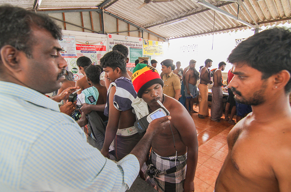 A player undergoes an alcohol test at a primary health centre, close to the jallikattu venue at Alanganallur. Strict guidelines, mandating alcohol tests and weight checks, were introduced after allegations were made that players came to the arena inebriated.